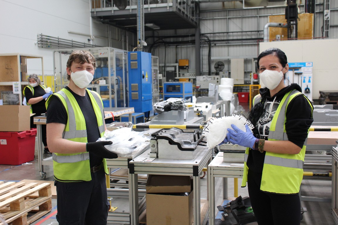 Autins' workers with the face masks